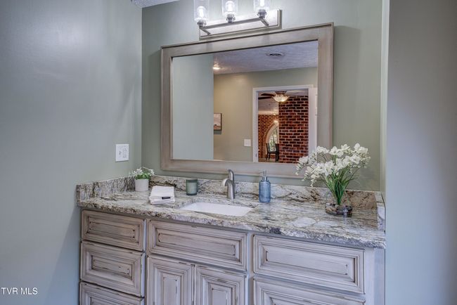 Bathroom w/ Quartz Counter Tops & Custom Wood Vanity | Image 28