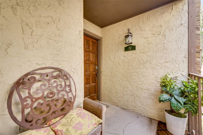 Property entrance featuring stucco siding and a porch | Image 20