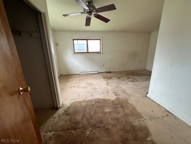 Spare room with ceiling fan | Image 9