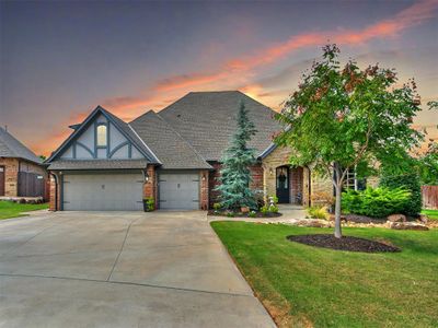 View of front of house featuring a faulous landscaping and a 3 car garage | Image 1