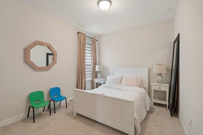 One of the three secondary bedrooms with luxury carpet. | Image 21
