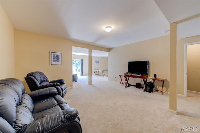 This view shows the doorway to the stairs that brought you downstairs and its relation to the game room and the outside. Behind you is one of the doors to the unfinished part of the basement. | Image 31