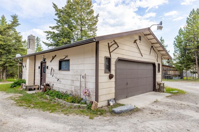 View of property exterior with a chimney | Image 12