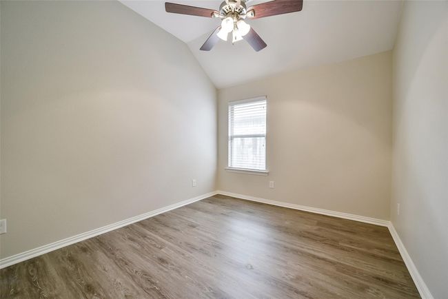 Bedroom 2 has a view of the side yard and a walk-in closet! | Image 25