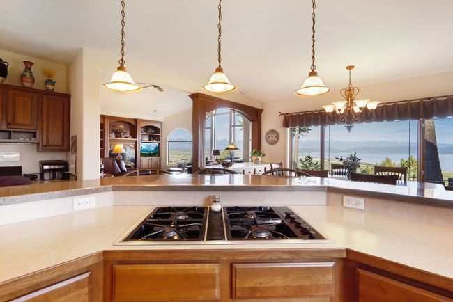 Kitchen looking out large windows to the Flathead Valley | Image 16