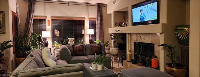 Living area featuring a premium fireplace | Image 4