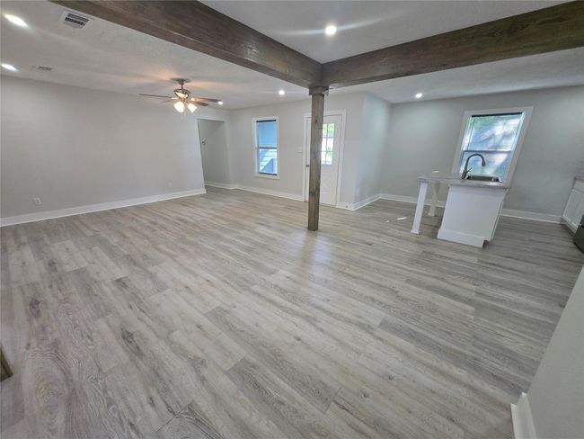 Living room featuring recessed lighting, light wood-style flooring, and ceiling fan | Image 5