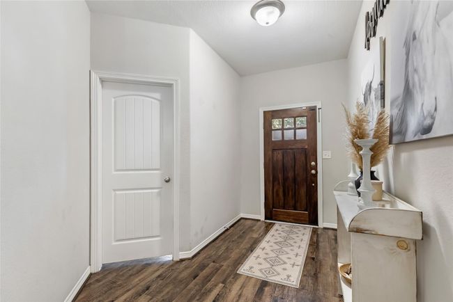 Looking back at the entry. One of four bedrooms is located at the front of the house. | Image 6