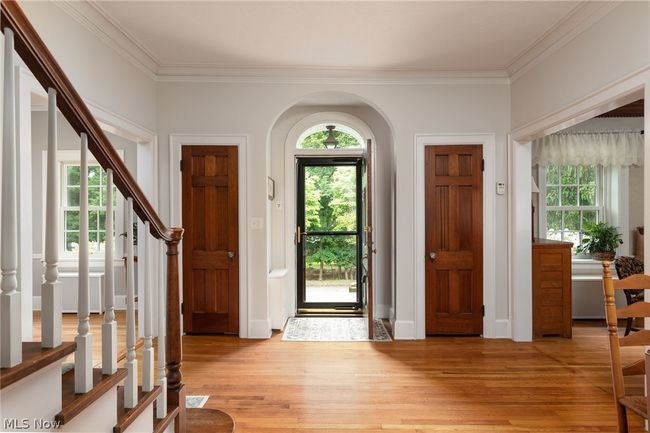 Entrance foyer with ornamental molding and light wood-type flooring | Image 15