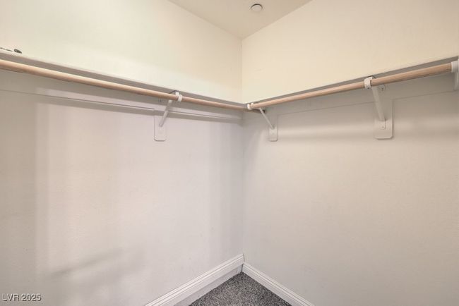 Walk in closet with carpet | Image 11