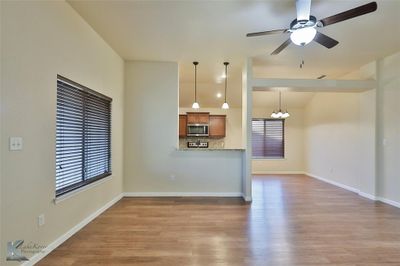 Living room featuring ceiling fan | Image 2