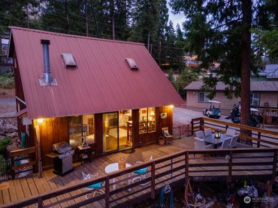 Exterior twilight view 1 of home w/ outdoor living area overlooking Lake Chelan. | Image 1