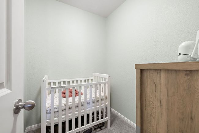 This is one of the TWO walk-in closets in the primary suite. It is so large the Sellers currently use it as a small nursery to be close to Baby! | Image 19