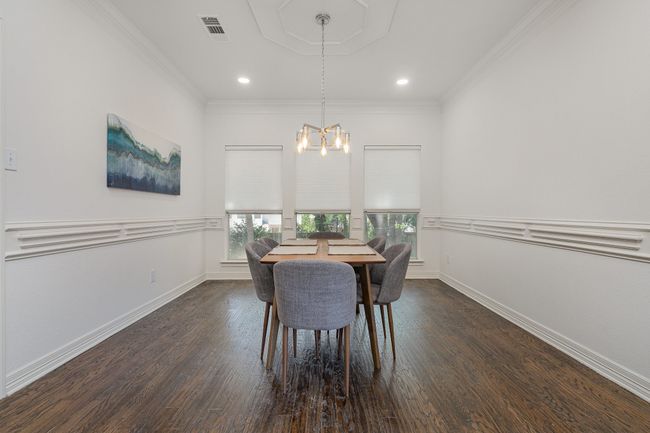 Dining room looks out to backyard, entrance to kitchen | Image 6