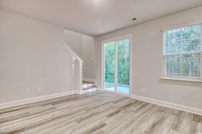 Unfurnished living room featuring light wood-type flooring | Image 17