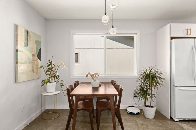 Dining space featuring baseboards and concrete flooring | Image 8