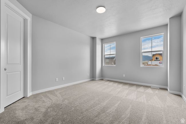 Unfurnished bedroom featuring carpet floors and baseboards | Image 8
