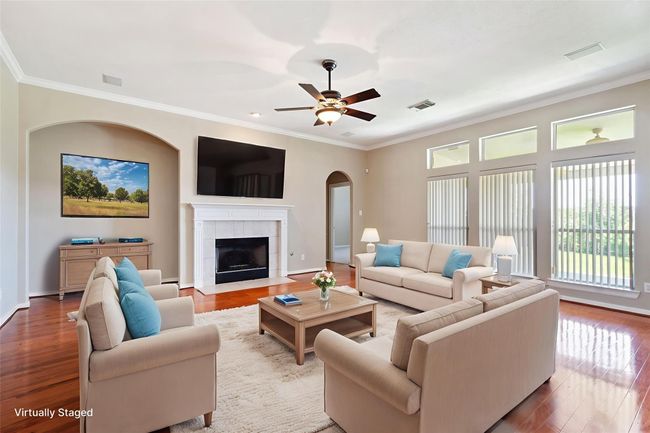 The gas log fireplace is perfect for cozy movie nights at home | Image 11