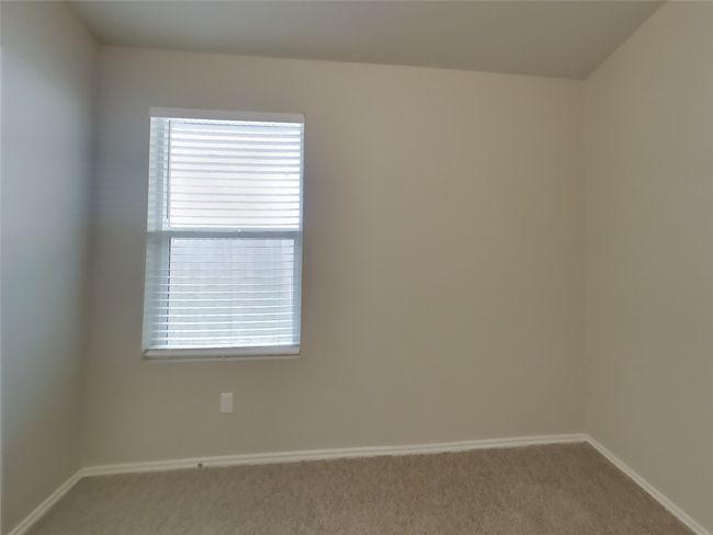 Unfurnished room featuring carpet floors and baseboards | Image 9
