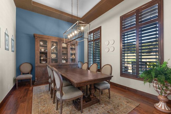 Dining area featuring a chandelier, and hardwood / wood-style floors | Image 5