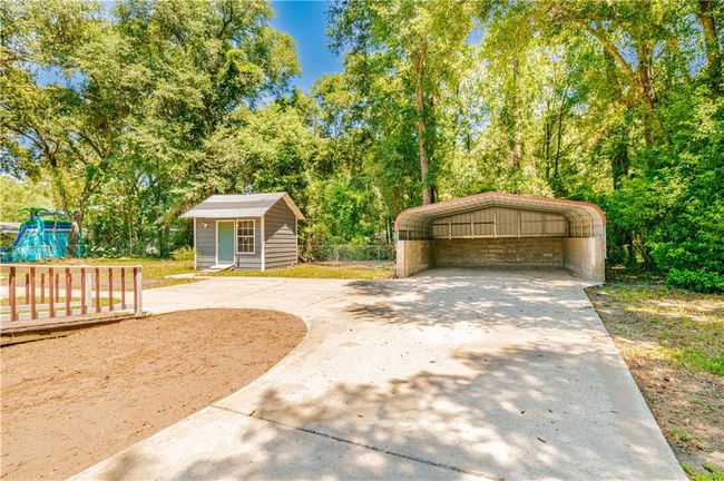 View of front of home with an outbuilding and a carport | Image 5