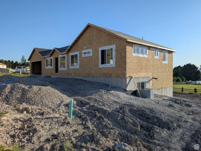 Rear view of property with a garage | Image 4