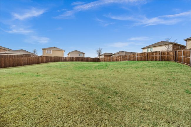 View of yard featuring a fenced backyard | Image 25