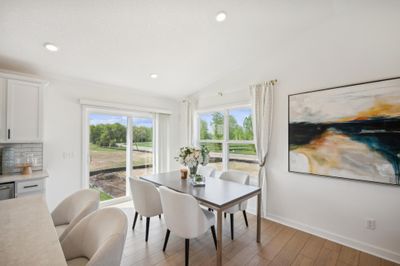 The dining room and kitchen island are both great seating options to suit you and your family | Image 3