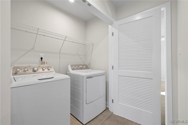 Laundry room with laundry area, washer and clothes dryer, and light tile patterned floors | Image 15