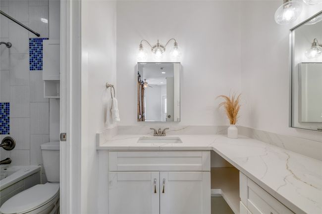 Full bath with vanity and shower / washtub combination | Image 11