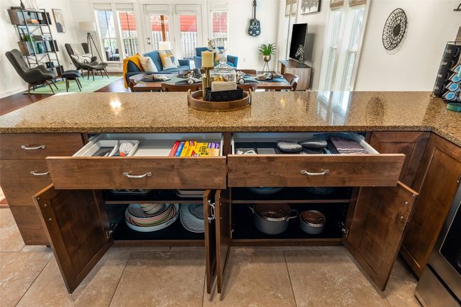 Kitchen featuring light stone counters and open floor plan | Image 27