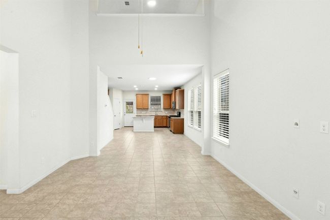 Inside, soaring ceilings in the living room and an open-concept layout create a bright, inviting feel that’s perfect for everyday living and entertaining alike. | Image 4