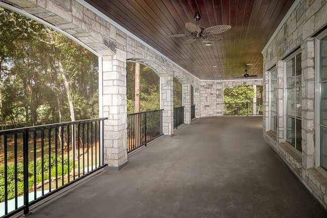 This enormous balcony overlooks the backyard and golf course | Image 27