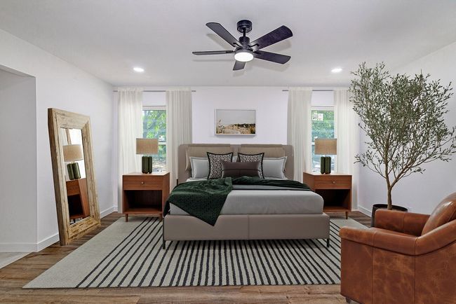 Bedroom with wood finished floors, recessed lighting, multiple windows, baseboards, and ceiling fan | Image 18