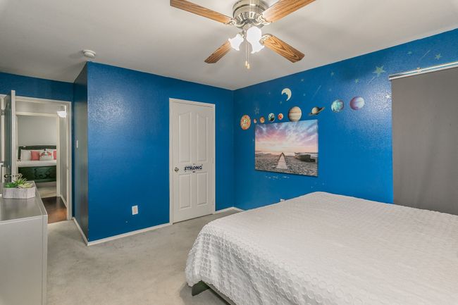 Bedroom with carpet floors and ceiling fan | Image 28