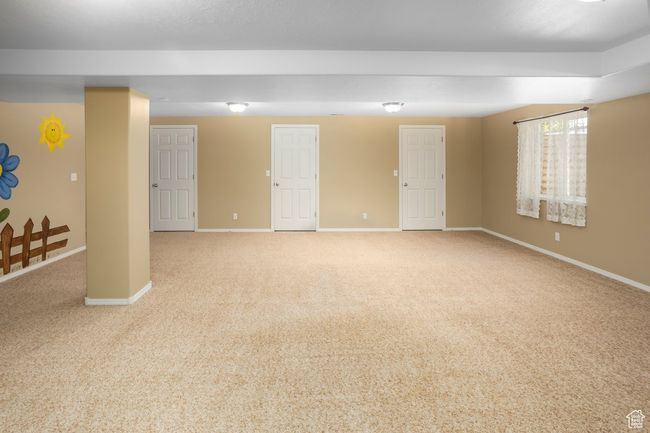 Basement with carpet floors and baseboards | Image 32
