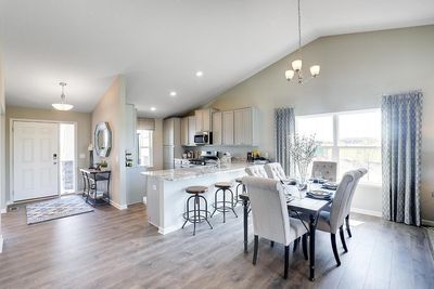 Open concept living at it's best with the vaulted main level ceilings! Photos of model home. Colors and options may vary. Ask Sales Agent for details. | Image 2