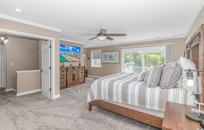 Carpeted bedroom featuring access to exterior, recessed lighting, ornamental molding, and a ceiling fan | Image 23