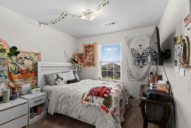 Bedroom featuring dark carpet and visible vents | Image 22