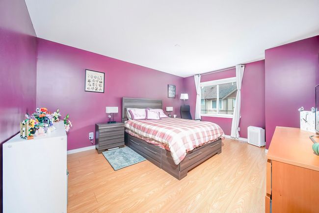 Bedroom featuring baseboards and light wood-style floors | Image 28