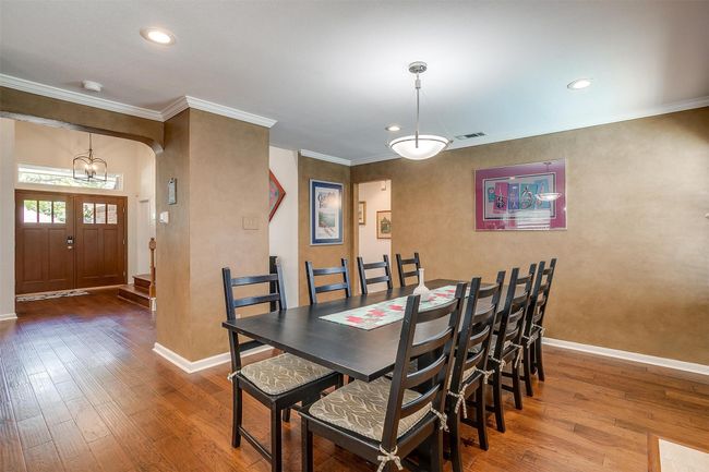 Dining Area or Optional Den with Wood Burning Fireplace | Image 16