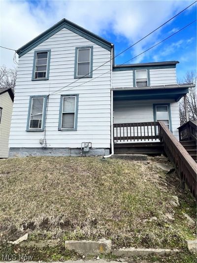 View of front of property featuring a front yard | Image 1