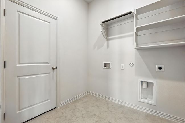 Laundry room featuring hookup for a gas dryer, hookup for a washing machine, and hookup for an electric dryer | Image 28