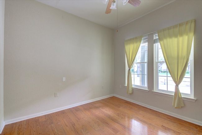 Bedroom 3 featuring light wood-type flooring and ceiling fan | Image 22