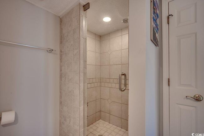 Bathroom with a textured ceiling and walk in shower | Image 15