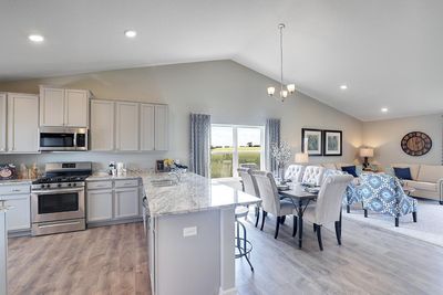 Extremely open and inviting, this main level is great for hosting or hanging out! Photo of Model Home. Options and colors may vary. Ask Sales Agent for details. | Image 3