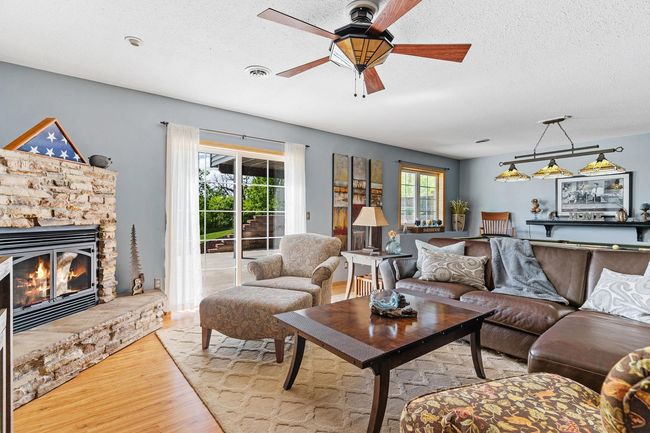 Sliding doors walk out to a large, partially covered patio for more entertaining space! | Image 45