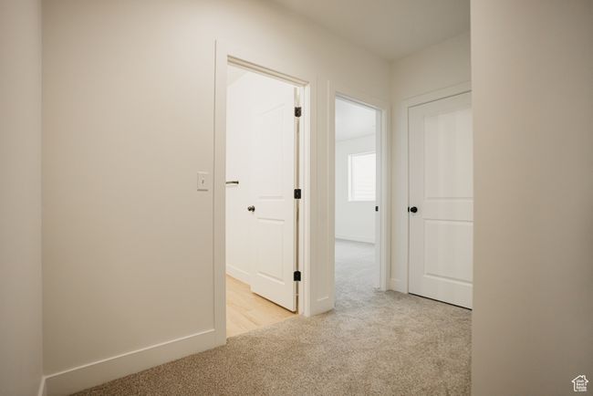 Corridor featuring light colored carpet | Image 30