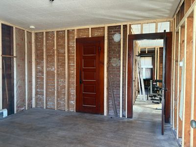 This view is from the living room looking into this floor's large kitchen. | Image 3