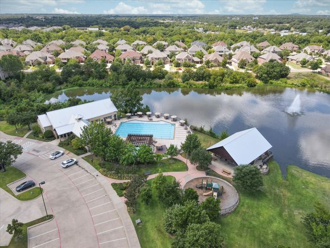 Aerial perspective of suburban area featuring a nearby body of water | Image 39